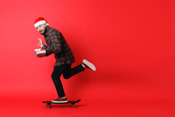 Man gesturing OK and delivering Christmas gifts