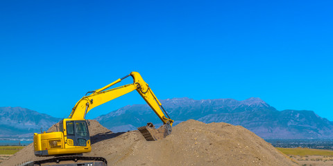 Canvas Print - Excavator scooping up dirt in Eagle Mountain Utah