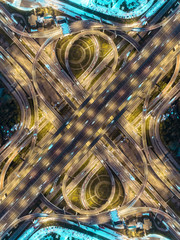 Wall Mural - Aerial view highway road intersection roundabout or circle at dusk for transportation, distribution or traffic background.