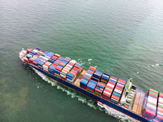 Aerial view of Small container ship at sea freight, Business International trade and Container logistics export-import harbor to the International port / Shipping Containers concept.