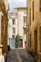 Wall Mural - Narrow street in historic city centre of Bordeaux