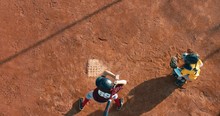 OVERHEAD CRANE Kid Boy Batter Baseball Player Hits A Ball Over A Home Plate. 4K UHD 60 FPS SLO MO RAW