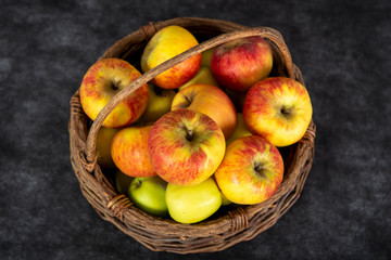 Wall Mural - basket with red and yellow apples