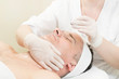 © lester120 - Man in the mask cosmetic procedure in spa salon.