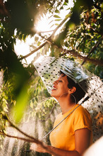 Woman With Umbrella In Wet Jungle