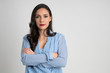 © Paul - Serious and beautiful woman looking at camera with arms crossed