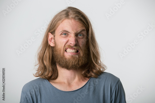 Young Bearded Guy With Disgusted Expression Making A Face Has