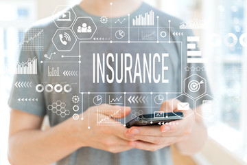 Wall Mural - Insurance with young man using a smartphone