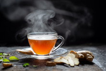 Hot Ginger Tea In A Glass On Wood Background.Hot Drink . Copy Space.