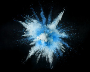 Wall Mural - Colored powder explosion on black background.