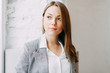 © pavelvozmischev - Young blogger girl with coffee sitting and working in a cafe. Bright portraits in the coffee shop, smiles and happy eyes. Business woman, strict style