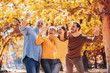 © Mediteraneo - Smiling family on an autumns day in park make selfie photo.