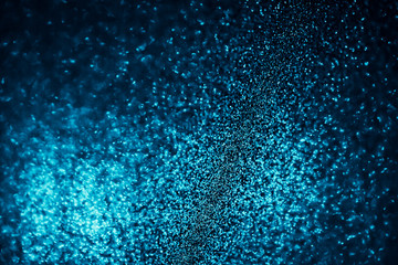 Poster - Abstract bokeh glitter background. Defocused background. Blurred bright light on black
