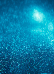 Poster - Abstract bokeh glitter background. Defocused background. Blurred bright light on black