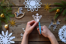 Making Paper Snowflakes With Your Own Hands. Children's DIY. Merry Christmas And New Year Concept. Step 2. Cut The Snowflake