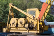 © donikz - old, yellow hydraulic crane on the street