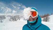 CLOSE UP: Excited Girl Wearing Ski Goggles Gets Hit In The Head By Snowball.