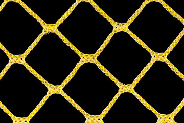 yellow mesh of rope on a black background