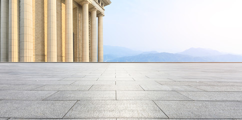 empty square floor and modern architecture with mountain natural scenery