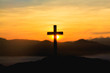 silhouette cross on mountain at mountain sunrise