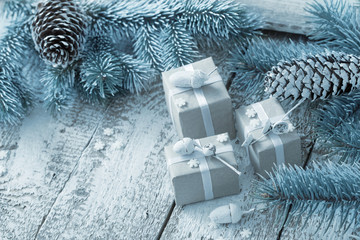 Christmas gifts on old wooden background