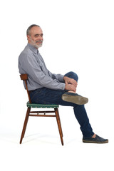 Wall Mural - portrait of middle aged man sitting  on white