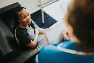 Female patient speaking to a nurse