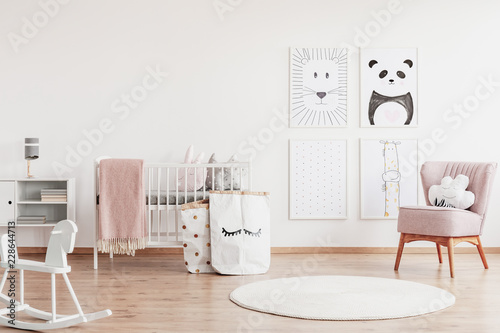 Stylish Scandinavian Nursery With White Furniture And Pink Accents