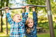 © Louis-Photo - The Two young children having fun on the playground