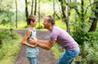 © Louis-Paul Photo - Father giving his son a piggyback ride, having fun