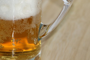 Cold foam beer into glass cup