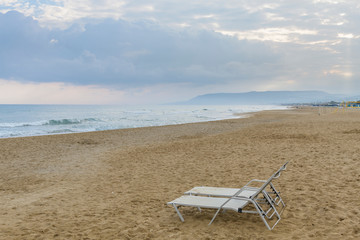 two chairs and umbrella on the beach