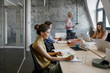 © LUMINA IMAGES - Group of businesspeople working at modern open space office.