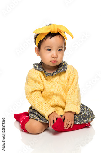 Fotografía Studio portrait of serious asian little girl child
