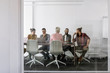 © LUMINA IMAGES - Group of young businesspeople having a meeting at meeting room.
