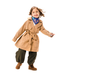 Wall Mural - happy little child in trench coat isolated on white