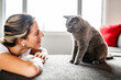 © Louis-Paul Photo - Nice Grey Cat with woman on sofa