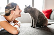 © Louis-Paul Photo - Nice Grey Cat with woman on sofa