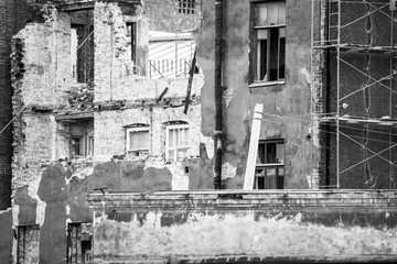 Scaffolding at a destroyed brick building