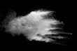 © Chaiwat - Explosion of white dust on black background.