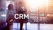CRM, Customer relationship management system concept on abstract blurred background.