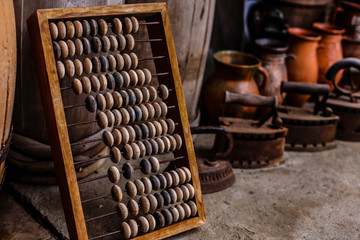 Vintage wooden abacus and old irons