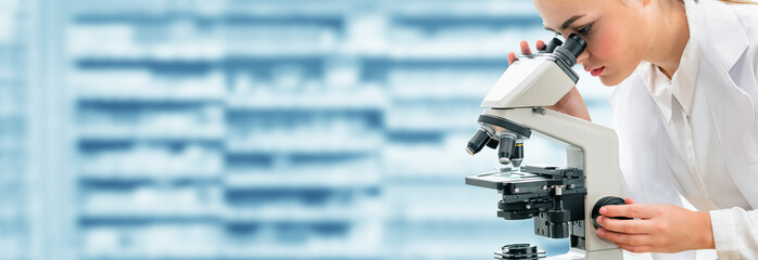 Poster - Scientist researcher uses microscope in laboratory