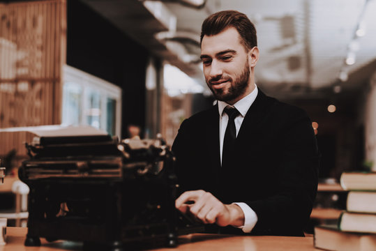 Creates Ideas. Businessman. Suit. Old Typewriter.