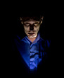 © Денис Кабелев - Stylish dark portrait of adult caucasian man who seems like maniac or psycho. Isolated on black background. Low-key lighting.