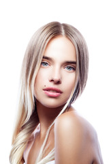 Young model girl beauty portrait. Perfect skin, natural nude make-up, beauty spot, blond hair style. White background. Skincare facial treatment female health concept