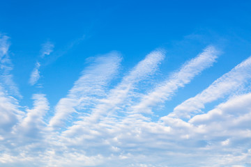 Wall Mural - blue sky with clouds shaped as spread fingers
