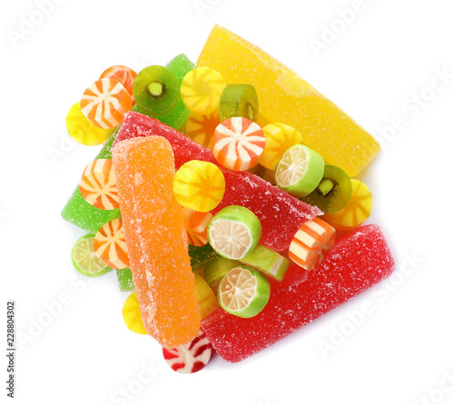 Plakat Pile of delicious colorful chewing candies on white background, top view