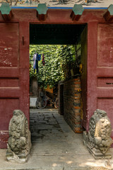 A view of an entrance of a courtyard in a  traditional Beijing Hutong in China - 2