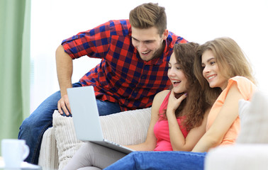 Poster - group of young people watching videos on the laptop.